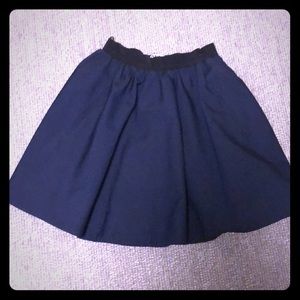 Navy circle skirt with black elastic waist.